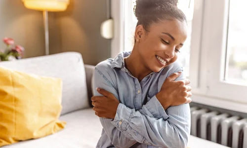 Woman hugging herself